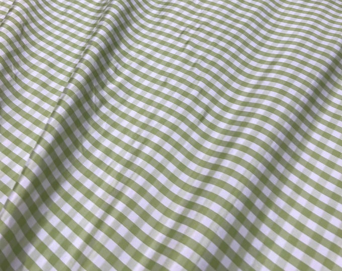 Beautiful taffeta Parrot Green & white gingham check 54” wide.  Best used for apparel and home Decore.  Sold by the yard