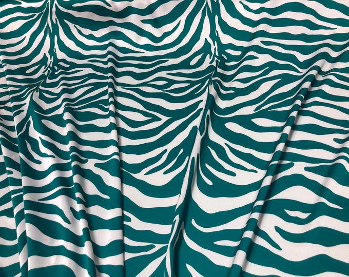 Beautiful green white zebra style designer digital print on silky satin Charmouse 54” wide. Sold by the yard. Best used for apparel