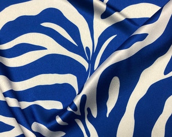 Beautiful royal blue & whote zebra pattern designer digital print on silky satin 54” wide. Sold by the yard. Best used for apparel