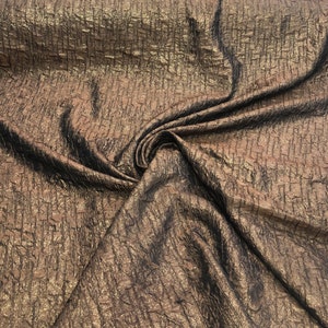 Polyester brocade fabric 60" wide    Beautiful copper color and wine color polyester brocade fabric sold  by the yard