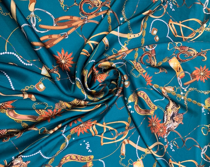 100% silk Charmouse jewelry print 54” wide.  Beautiful dark turquoise base with jewelry print.  Sold by the yard