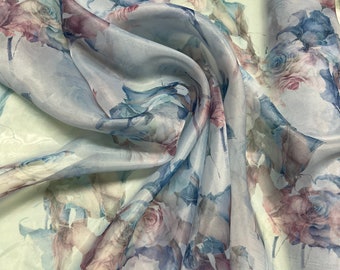 Satin face organza, also called Gazzar 54” wide. Beautiful baby blue base with blue copper color floral digital design