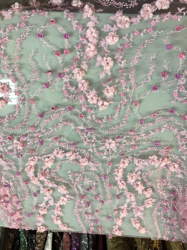 MAUVE/ROSE HAND BEADED FLORAL DESIGN EMBROIDERY ON A MESH LACE-SOLD BY YARD.