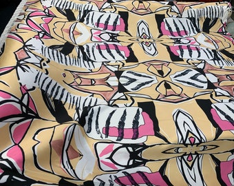 Mikado Zibelline printed fabric 54” wide. Beautiful African print canary yellow base with black pink print best used for apparel.