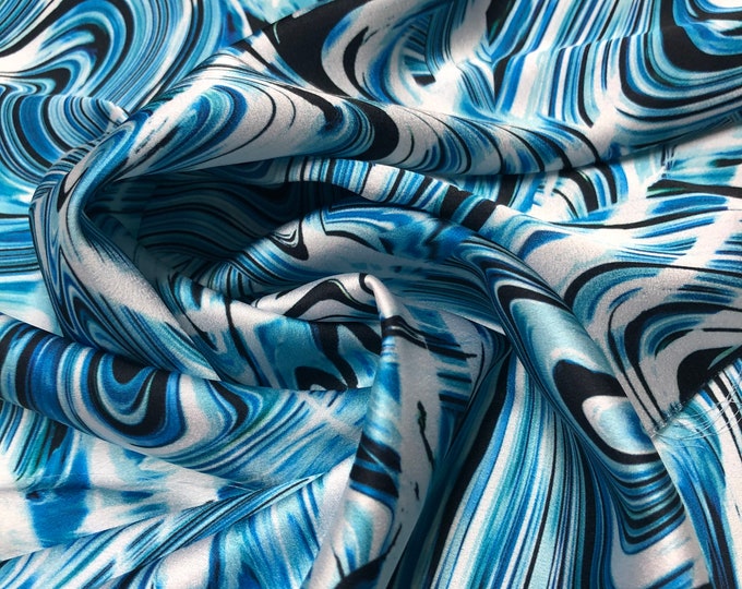 Beautiful aqua baby blue white swirl design digital print 54” wide.  Satin Charmouse digital print. Sold by the yard