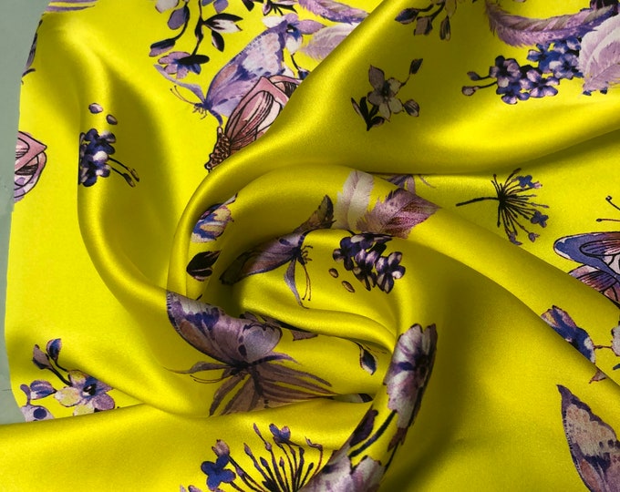 100% silk satin charmeuse digital print 54" wide    Beautiful yellow base with purplish shade floral designs print  silky soft fabric