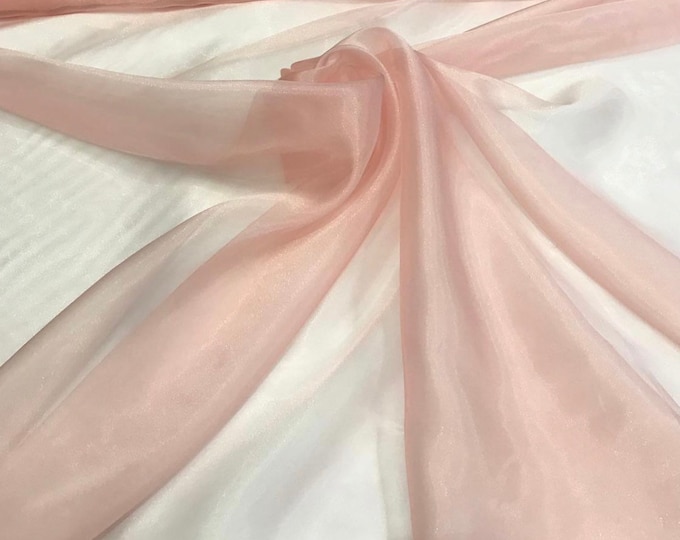 100% polyester organza 60" wide   Beautiful peach color organza fabric sold by the yard