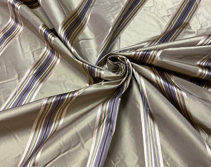 100% silk beautiful beige tan gold  with purple shades  satin stripes.  silk satin taffeta 54" wide            Sold by the yard