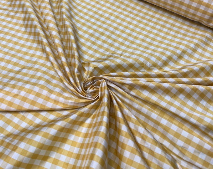 Beautiful taffeta Yellow & white gingham check 54” wide.  Best used for apparel and home Decore.  Sold by the yard