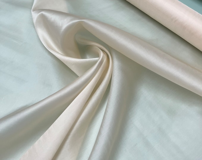 100% silk satin face organza, beautiful champagne color Silk satin organza also called silk Gazzar. 54” wide. Sold by yard