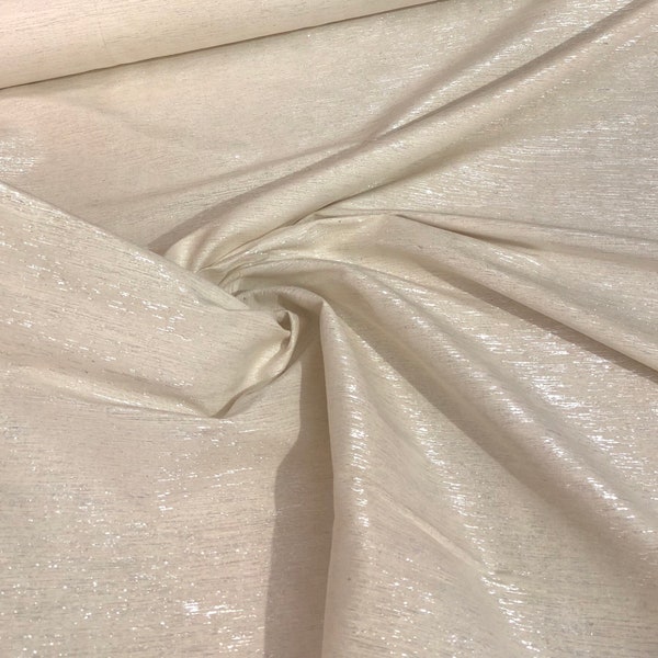 Raw silk 48" wide   Beautiful ivory color noil silk with matalic silver stripes in the fabric sold by the yard