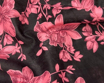 100% Linen designer print, black base with coral pink floral  designer printed linen. 58” wide Sold by the yard