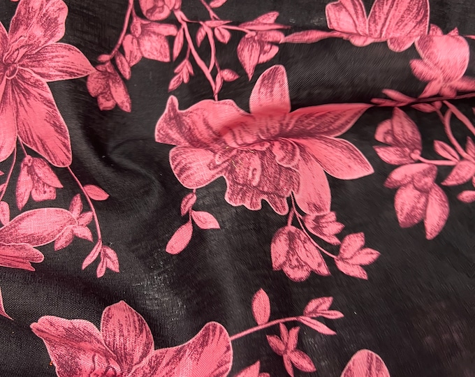 100% Linen designer print, black base with coral pink floral  designer printed linen. 58” wide Sold by the yard