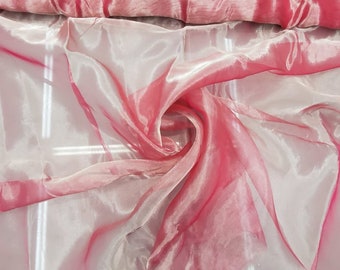 Beautiful fusia pink silver  Irredescent matalic silk organza 45” wide. Best used for apparel and home Decore. Sold by the yard