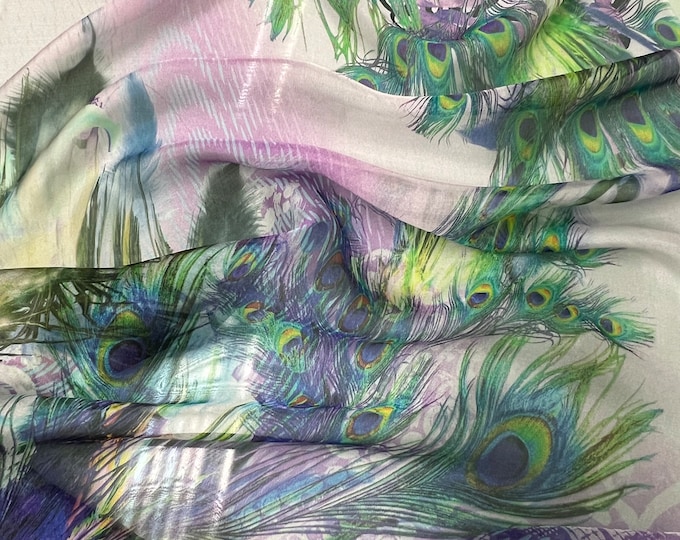 100% silk satin face chiffon digital print 54" wide    Beautiful ivory lilac base with purple border style floral & peacock feather design