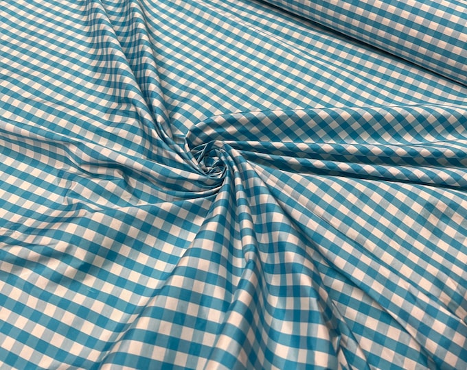 Beautiful taffeta turquoise & white gingham check 54” wide.  Best used for apparel and home Decore.  Sold by the yard