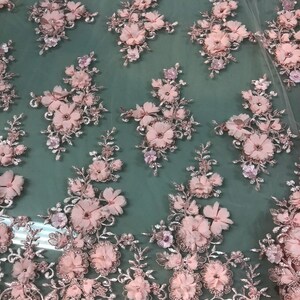 LIGHT PINK HAND BEADED FLORAL DESIGN EMBROIDERY ON A MESH LACE-SOLD BY YARD.