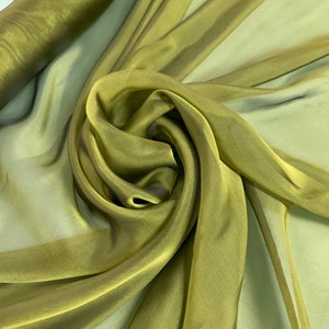 Beautiful olive Irredescent color 100% silk chiffon 54” wide.  Best used for apparel.  Sold by the yard