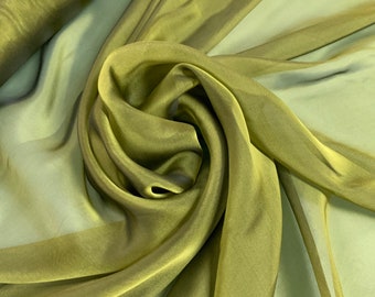 Beautiful olive Irredescent color 100% silk chiffon 54” wide.  Best used for apparel.  Sold by the yard