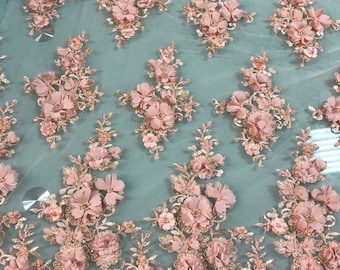 Hand beaded floral design with 3D flowers peach color lace on mesh fabric sold by the yard