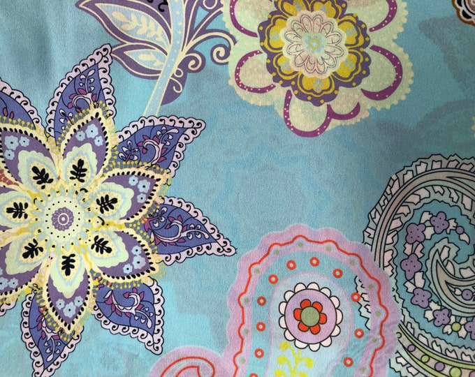 Beautiful paisley floral multi color base aqua shades digital print on silky satin 54” wide. Sold by the yard. Best used for apparel