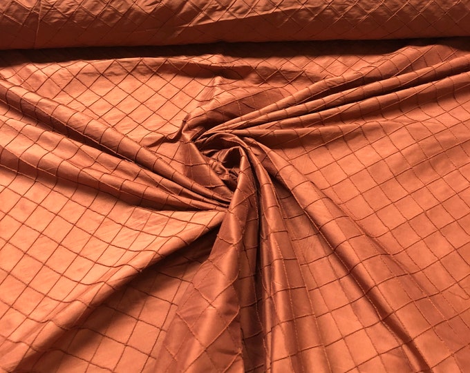 100% silk beautiful brick color silk pintuck 52” wide. Best used for appreal and home decor. Sold by the yard.
