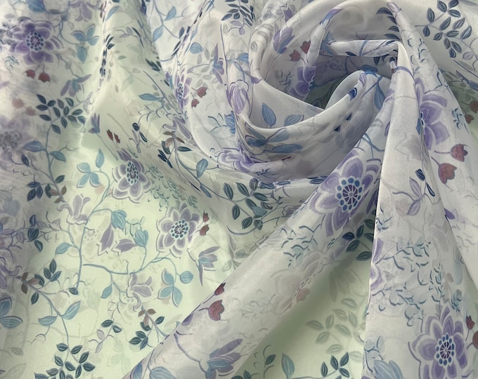 Satin face organza, also called Gazzar 54” wide. Beautiful white base with baba blue color floral digital design