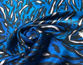 100% silk satin charmeuse digital print 54" wide    Beautiful royal blue color animal print  silky soft fabric sold by the fabric