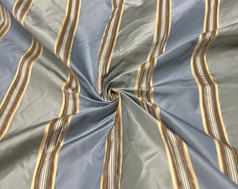 100% silk beautiful light gray with blueish gray satin stripes with Velevt Embosed stripe silk taffeta 54" wide            Sold by the yard