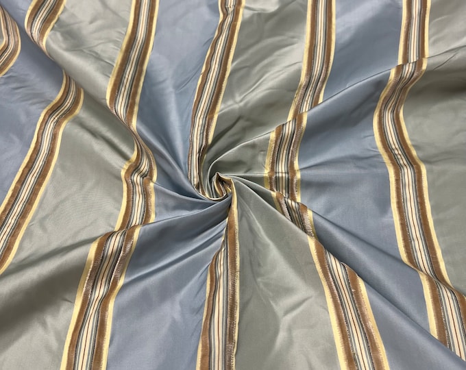 100% silk beautiful light gray with blueish gray satin stripes with Velevt Embosed stripe silk taffeta 54" wide            Sold by the yard