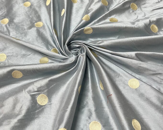 Beautiful 100% silk shantung embroidery 54” wide.  Baby blue base color with champagne gold polka dot embroidery.  Best used for home Decore