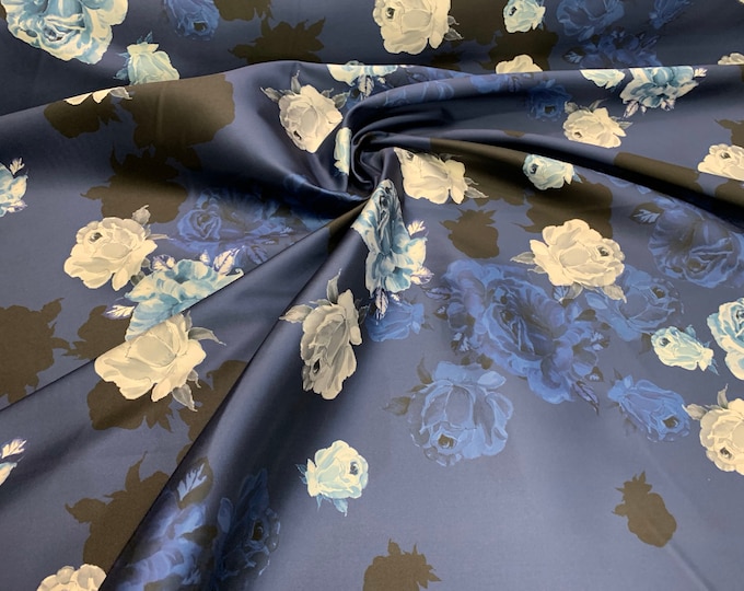 Mikado Zibelline printed fabric 54” wide.  Beautiful navy base color floral design.  Beat used for apparel.  Sold by the yard