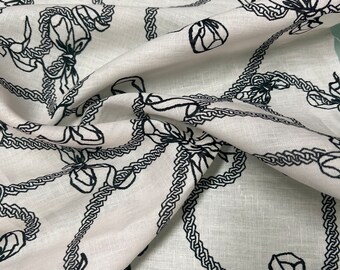 100% Linen designer print, Ivory base with black jewelry designer printed linen. 58” wide Sold by the yard