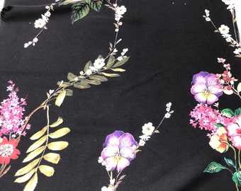 Beautiful black base woth multi color flower designer pattern digital print on silky satin 54” wide. Sold by the yard. Best used for apparel