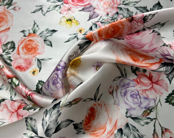 100% silk satin charmeuse digital print 54" wide    Beautiful ivory base with soft pink yellow purple gray allover floral design 54” wide
