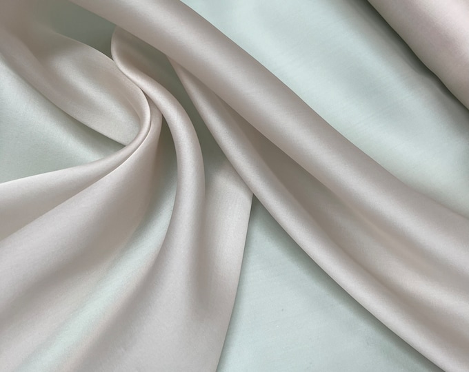 100% silk satin face organza, beautiful dusty rose pink  color Silk satin organza also called silk Gazzar. 54” wide. Sold by yard