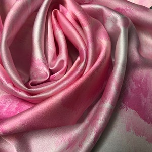 Digital satin Charmouse print 54” wide.  Beautiful abstract claud style ivory pink shades patten digitally printed fabric used for apparel.