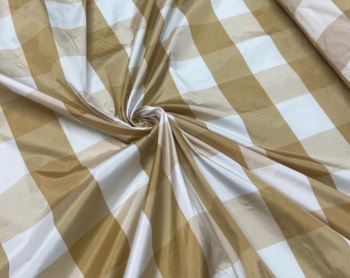 Beautiful Tan and white taffeta plaids 54” wide.  Best used for home decor and appreal.  Sold by the yard