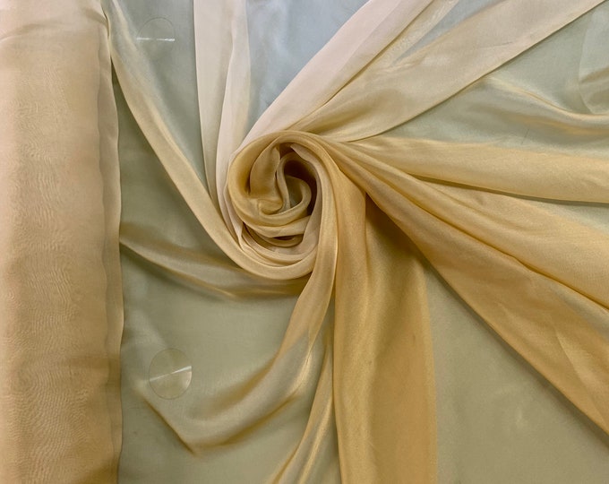 Beautiful Light gold to dark gold ombré French silk chiffon 54” wide.  Best used for apparel.  Sold by the yard
