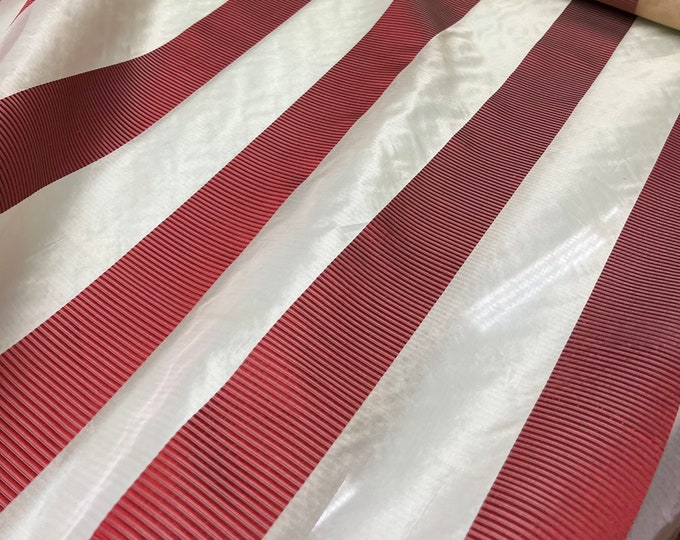 100% silk organza, beautiful champagne cream color Silk organza with brick red Jaquard stripes. 54” wide. Sold by yard