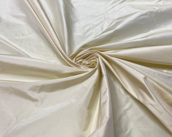 Beautiful Pastel Lemon Yellow Irredescent 100% silk taffeta 54” wide.  Best used for apparel and home Decore.  Sold by the yard