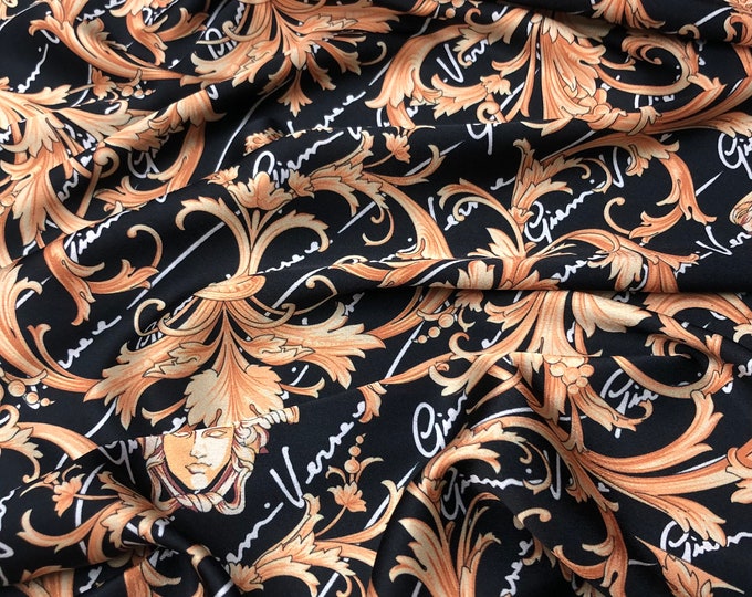 Beautiful designer brand digitally printed black and gold color satin Charmouse 54” wide. Sold by the yard