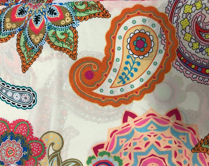 Beautiful paisley floral multi color cream base shades design digital print on silky satin 54” wide. Sold by the yard. Best used for apparel