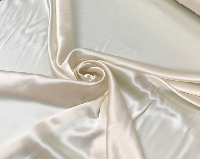 Silk charmouse 54" wide   Beautiful champagne cream color silk charmouse fabric sold by the yard