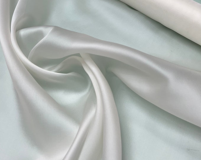 100% silk satin face organza, beautiful white color Silk satin organza also called silk Gazzar. 54” wide. Sold by yard
