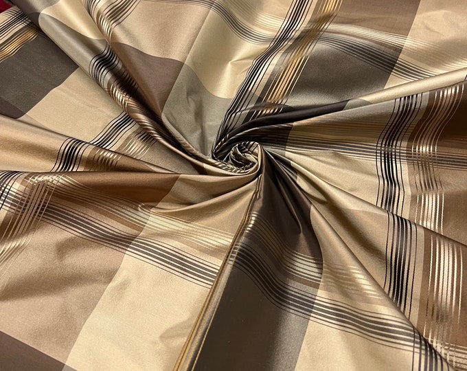100% silk beautiful beige tan black gold with gold satin stripe plaids .  silk taffeta 54" wide            Sold by the yard