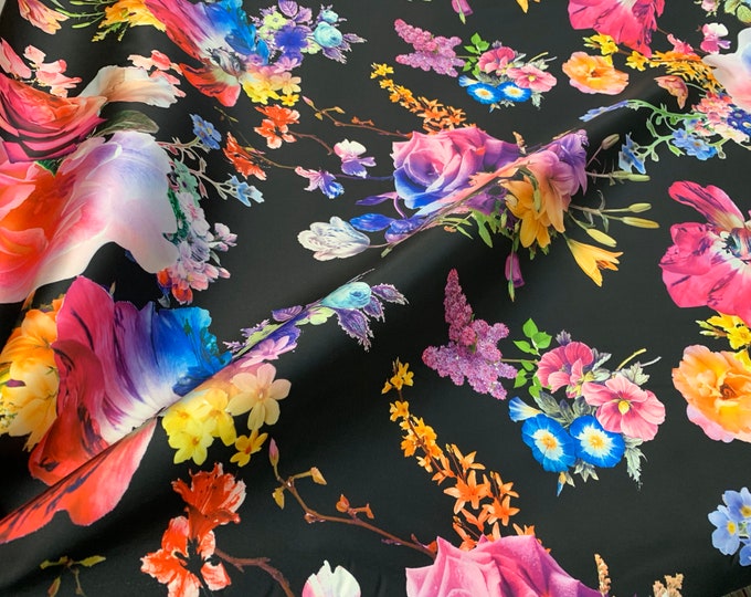 Mikado Zibelline printed fabric 54” wide. Beautiful black base multi color floral design beat used for apparel. Sold by the yard