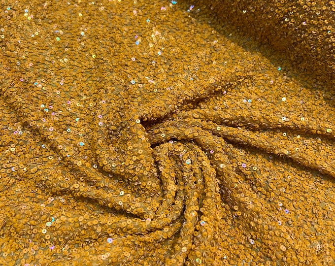 Beautiful Mustard color tiny florescent sequin hand embroidered on silk chiffon 45” wide. Best use for apparel
