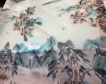 Satin face organza, also called Gazzar 54” wide. Beautiful ivory base mountain scenic view print in blue shades painting  style design