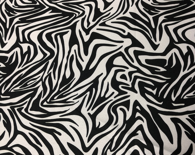 Beautiful black and white zebra print on saying Charmouse 54” wide sold by the yard